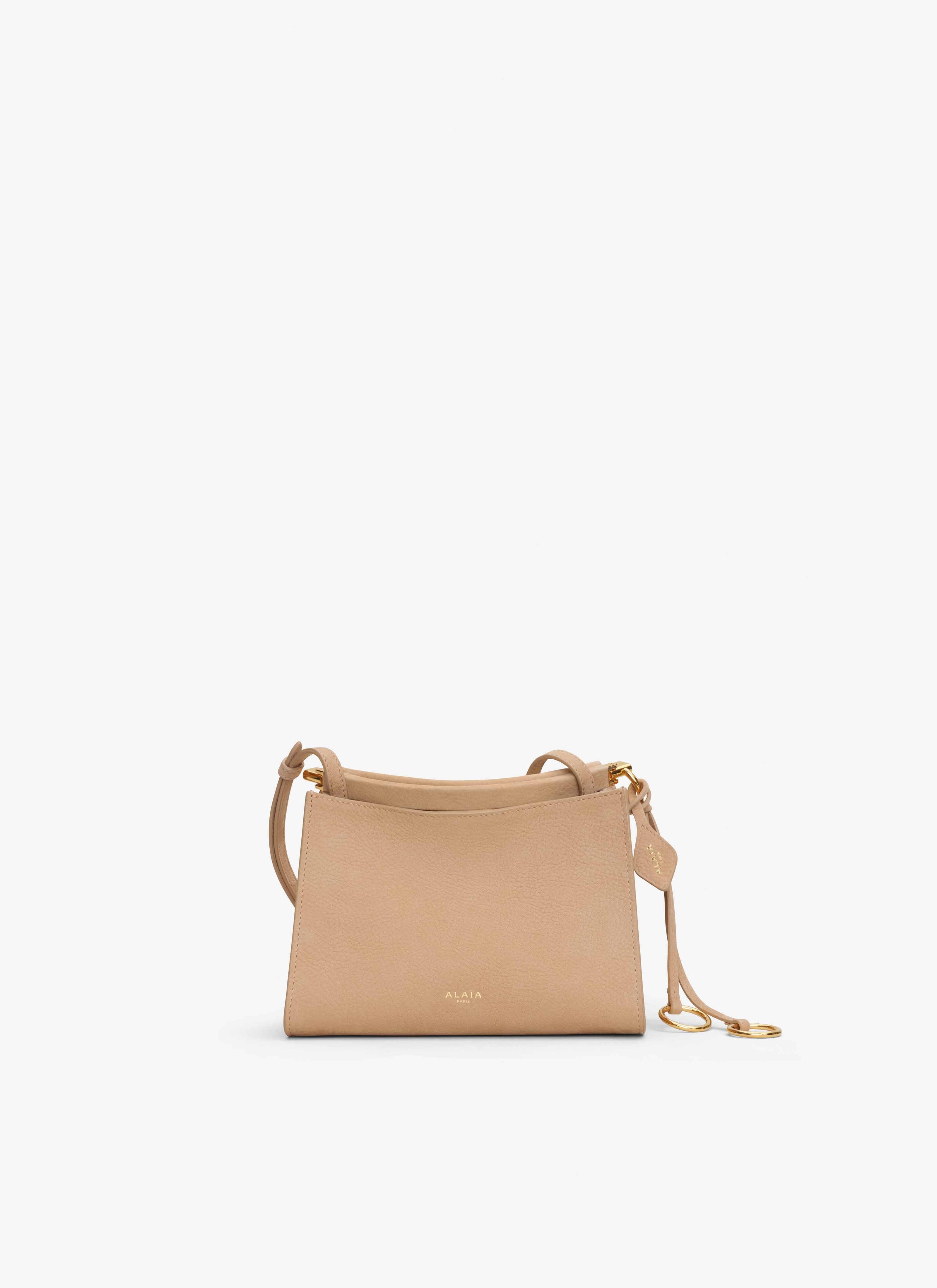 ALAÏA DESERT LE CLICK SMALL SQUARE BAG IN NUBUCK 