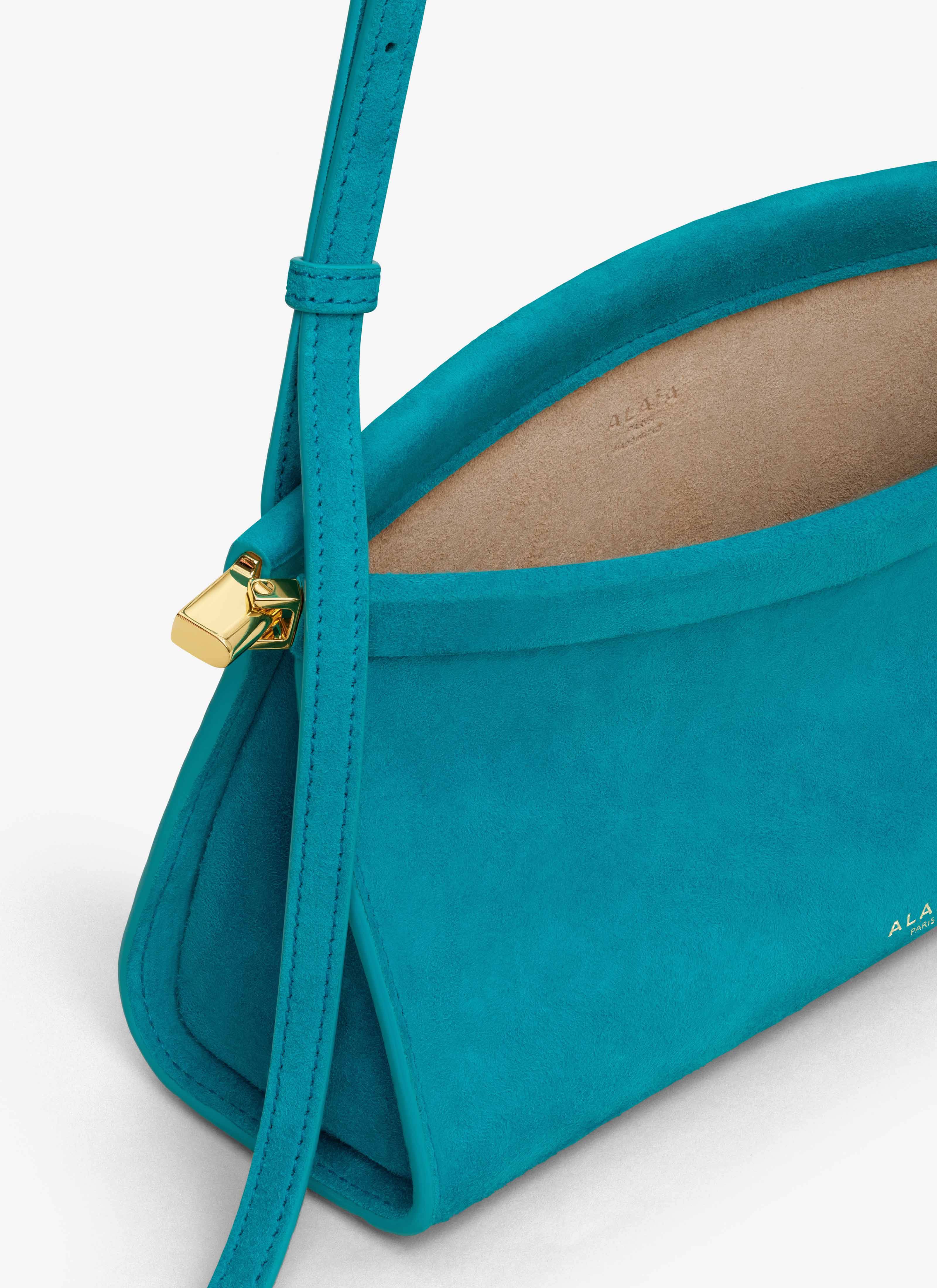 ALAÏA TURQUOISE LE CLICK EAST WEST SMALL BAG IN SUEDE