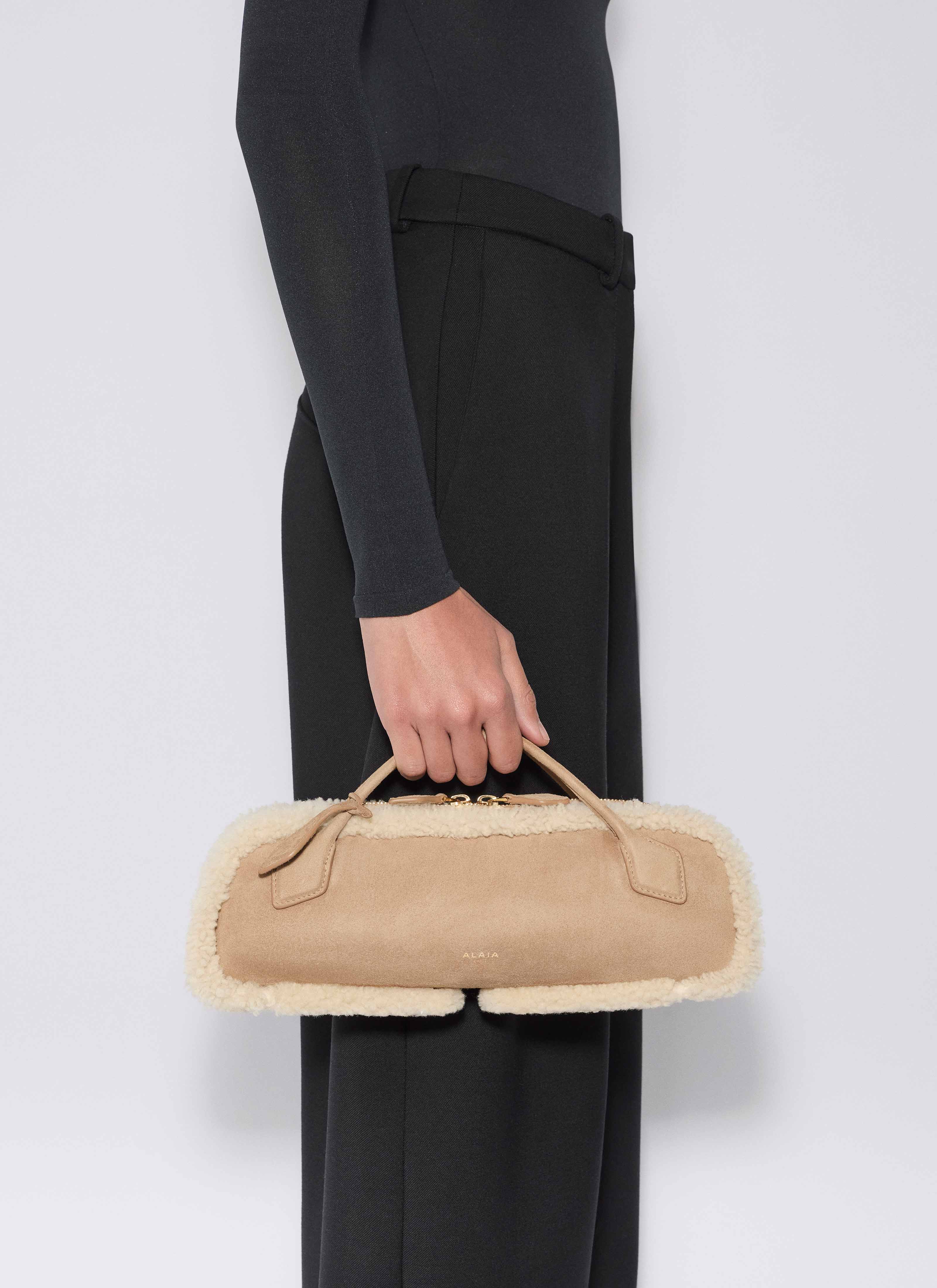 ALAÏA CAMEL LE TECKEL CLUTCH IN MERINO SHEARLING