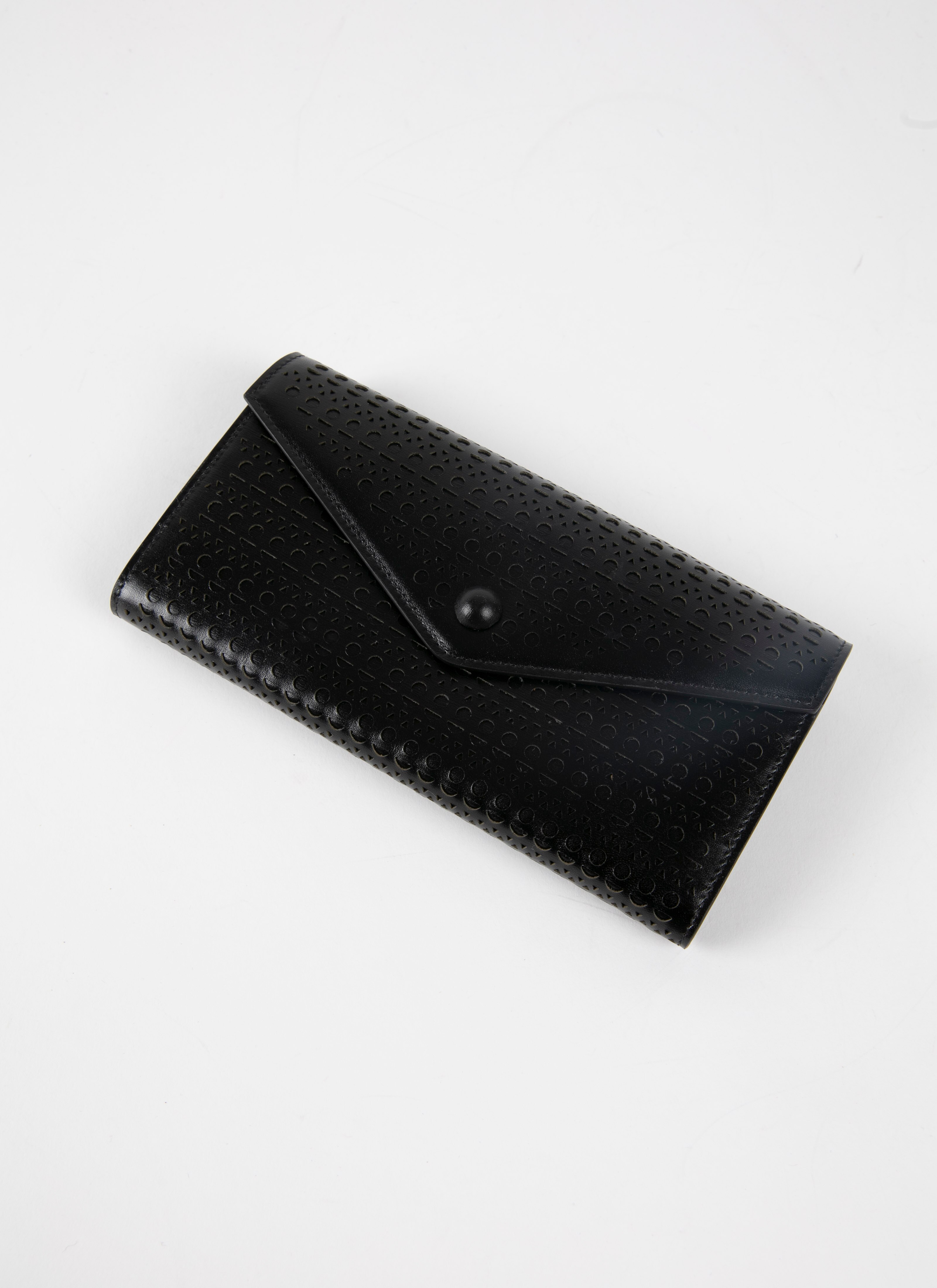 ALAÏA BLACK OPENWORK LEATHER FLAP WALLET