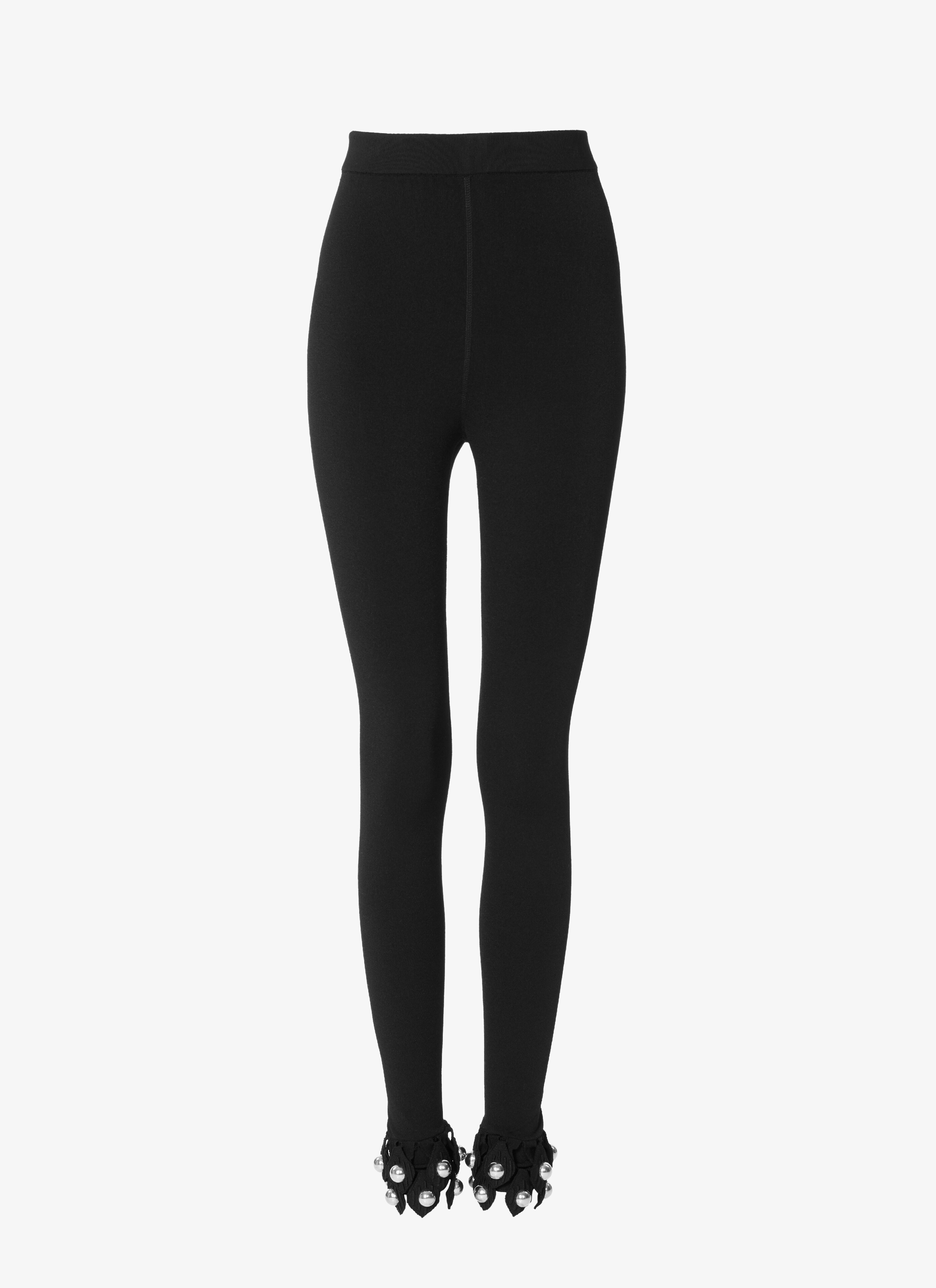 ALAÏA BLACK KNITTED LEGGINGS WITH METALLIC STUDS