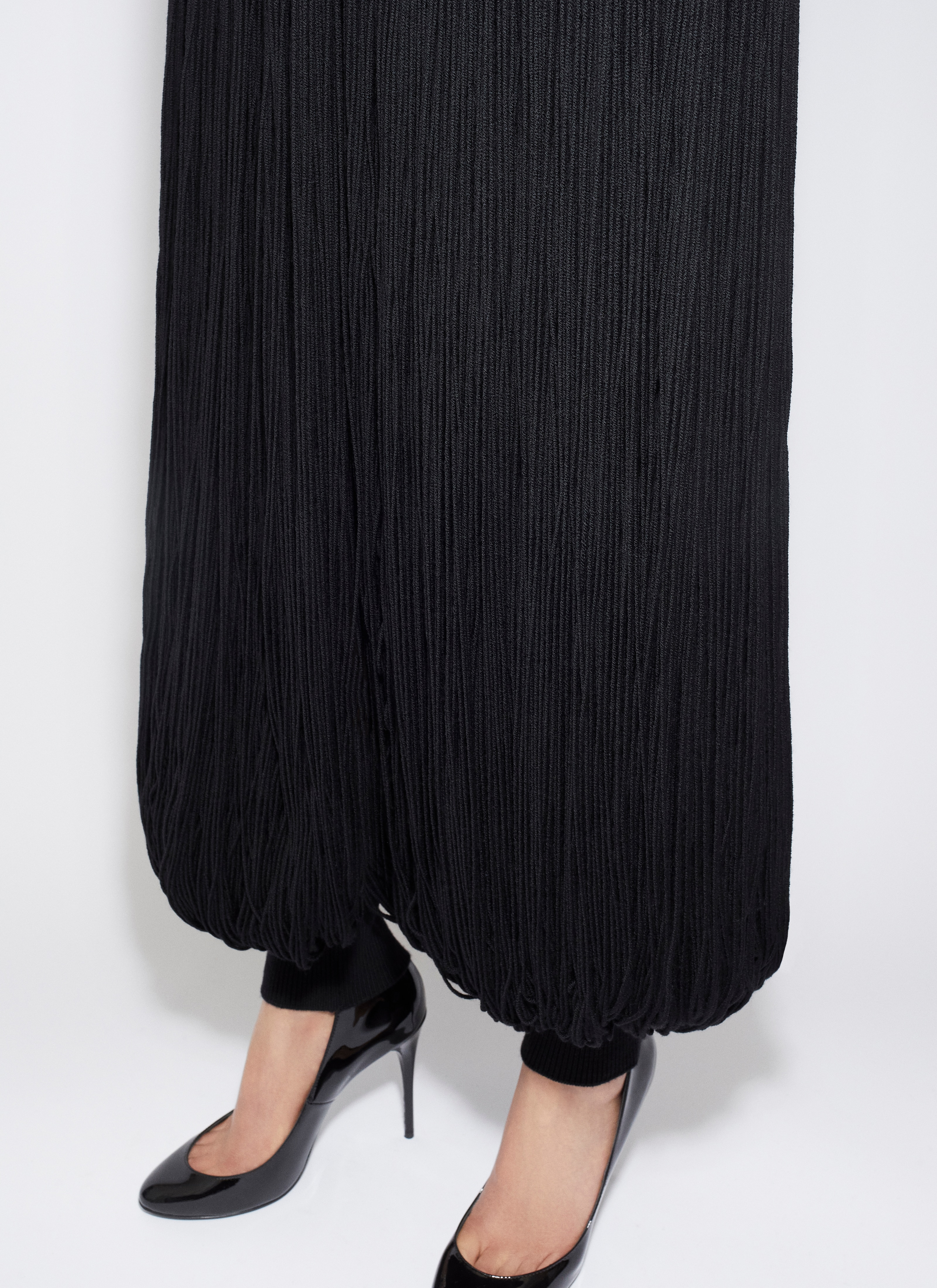ALAÏA NERO PANTALONI ARROTONDATI IN MAGLIA CON FRANGE